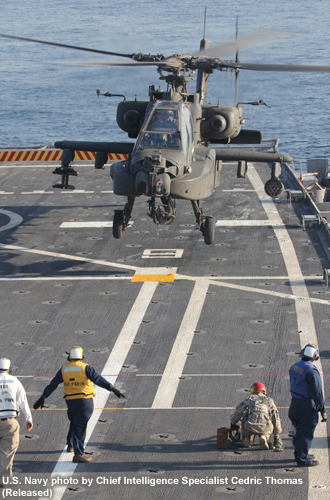 photo of helicopter landing on carrier